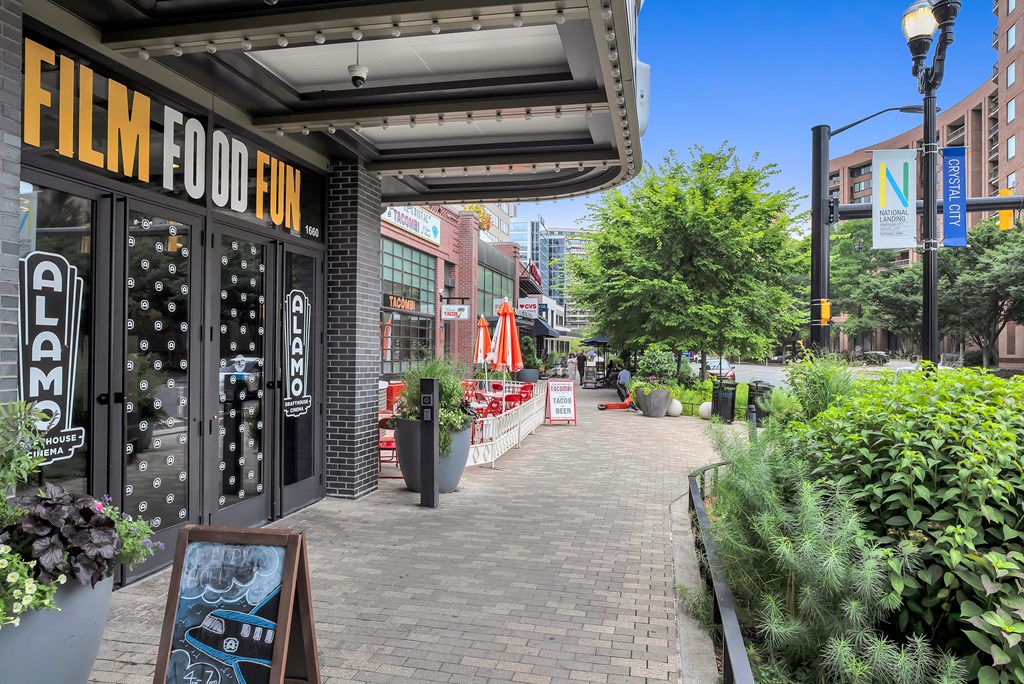 a brick sidewalk with a building with a sign that reads fish food box