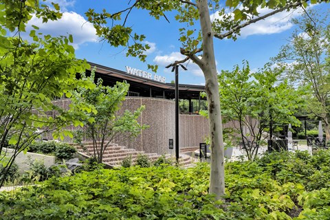 a view of the front of a building with trees