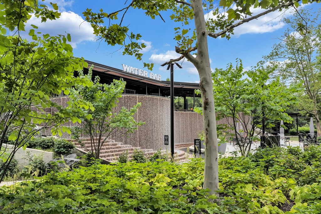 a view of the front of a building with trees