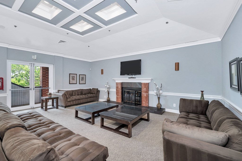 a living room filled with furniture and a fireplace