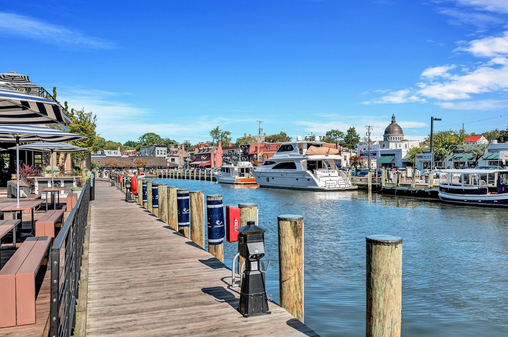a dock with boats docked in the water at a marina