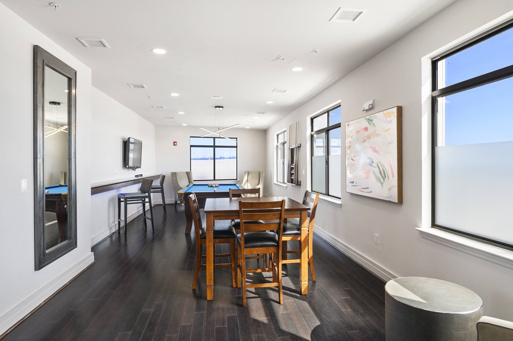 Exclusive resident lounge with kitchen, bar top, and billiards Modern apartment rentals in Crystal City Arlington VA