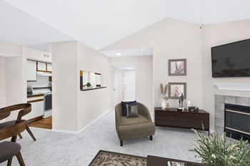 Living areas with plush carpet and wood-burning fireplace Woodbridge military apartments - Photo Gallery 4