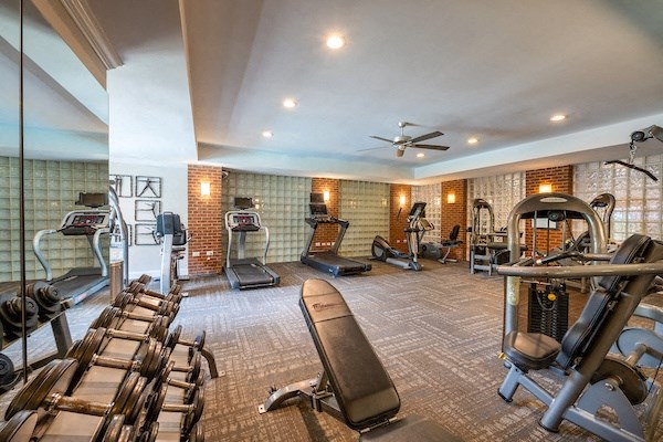 a gym with a lot of exercise equipment