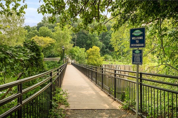 a bridge with a sign that says welcome to brooklyn