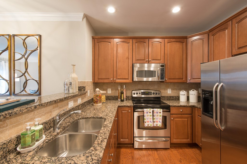 Granite countertops, recessed lighting and stainless steel appliances at The Cosmopolitan at Lorton Station, Virginia