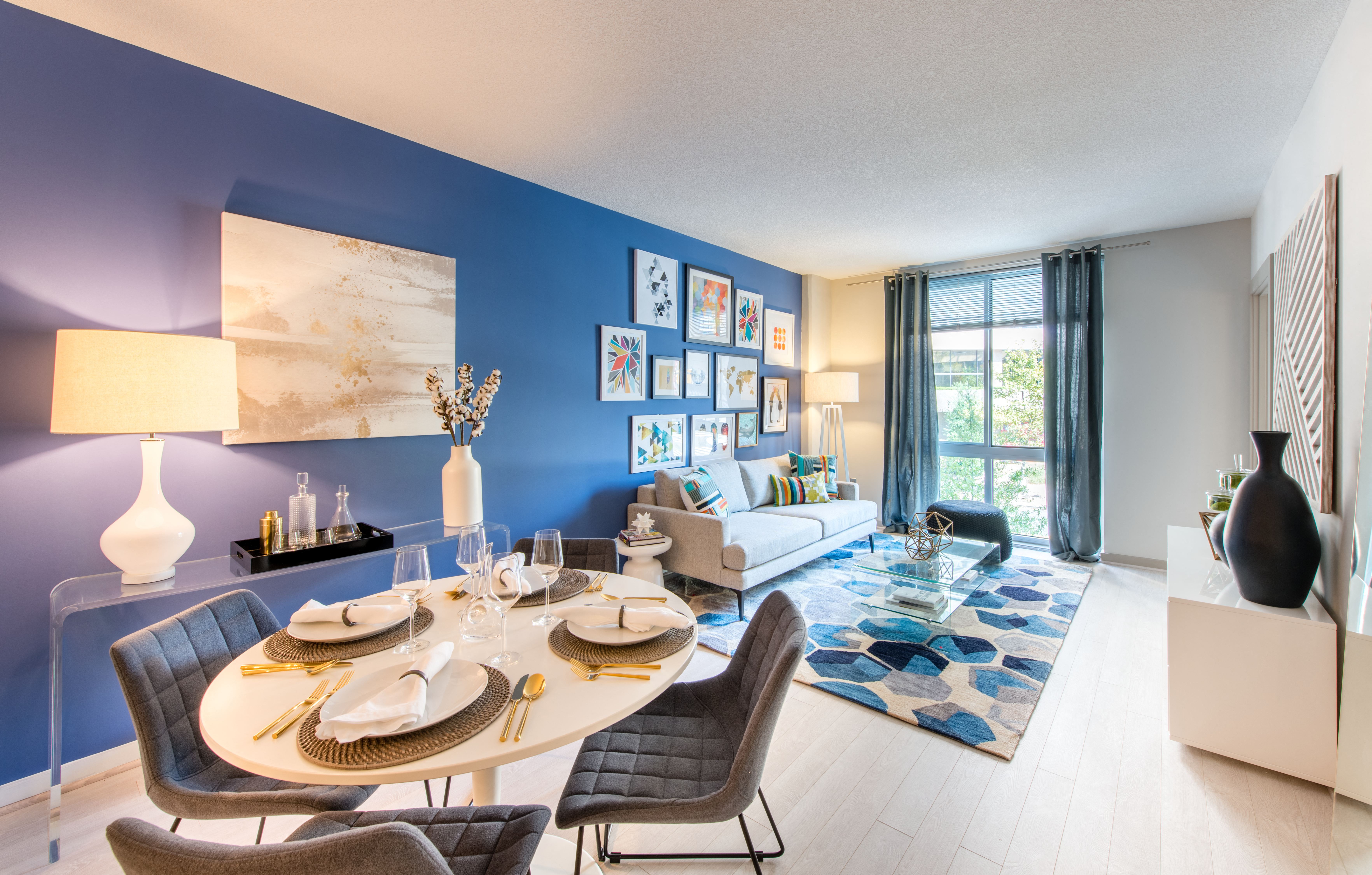 a living room with a dining room table and a couch