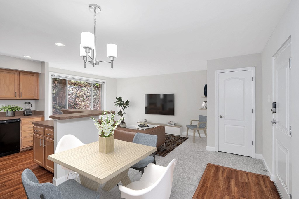 a living room with a table and chairs