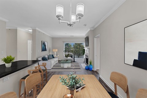 A modern dining room with a wooden table and chairs.