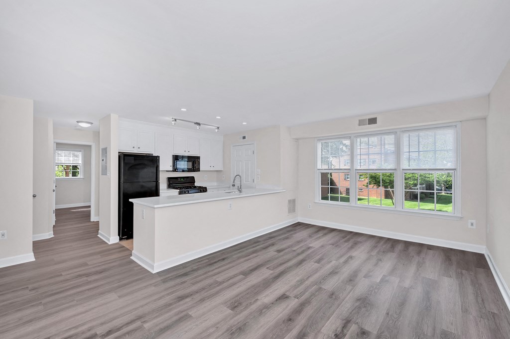 a kitchen and living room in a 555 waverly unit