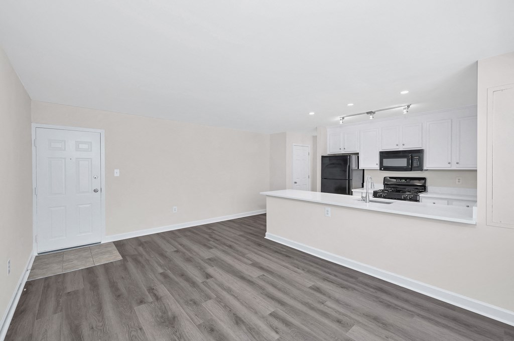 a kitchen and living room in a 555 waverly unit