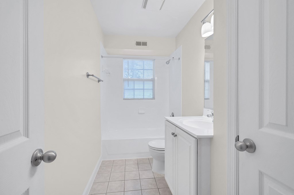a bathroom with a toilet sink and bathtub