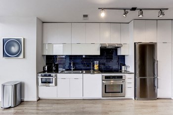 Custom Kitchen Cabinetry with Quartz Countertops Luxury Apartment Rentals in Shaw DC - Photo Gallery 6