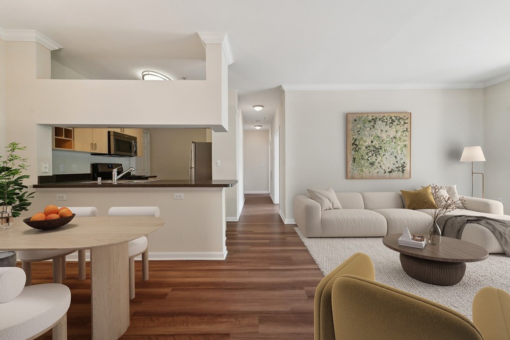 A modern kitchen with a dining table and chairs.
