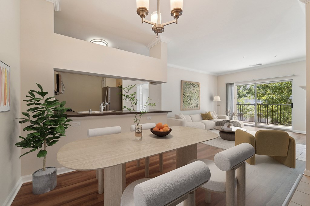 A modern dining room with a round table and chairs.