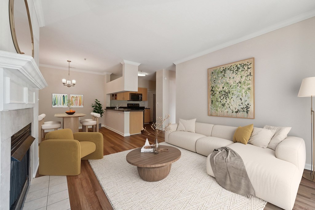 A living room with a white couch and a coffee table.