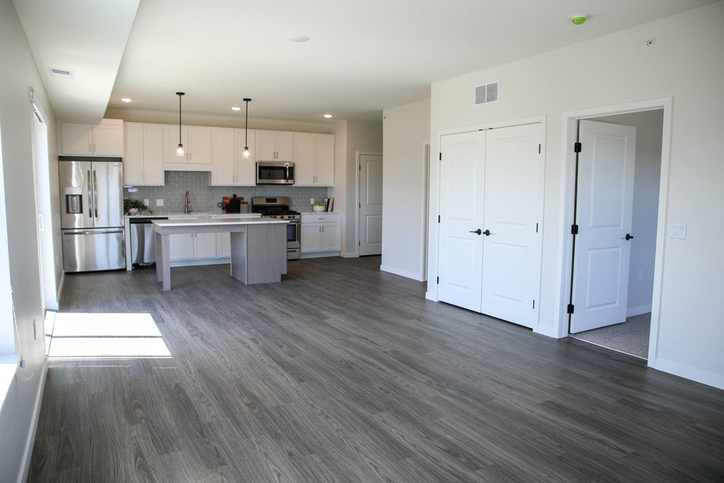 a kitchen and living room in an apartment