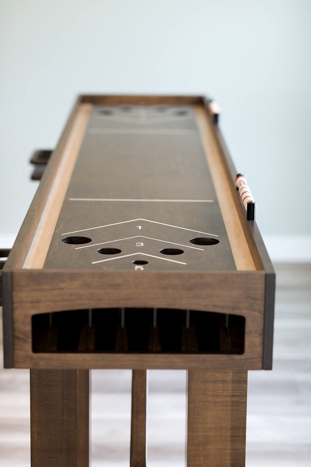 a close up of the shuffleboard table