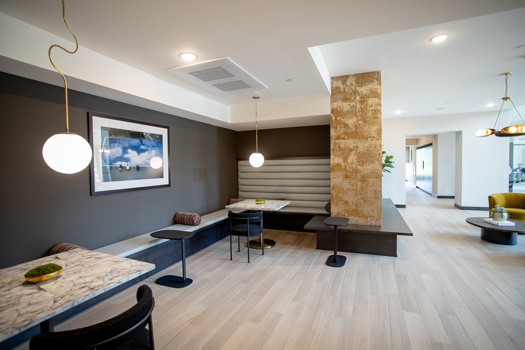 a dining room with a table and chairs and a lobby