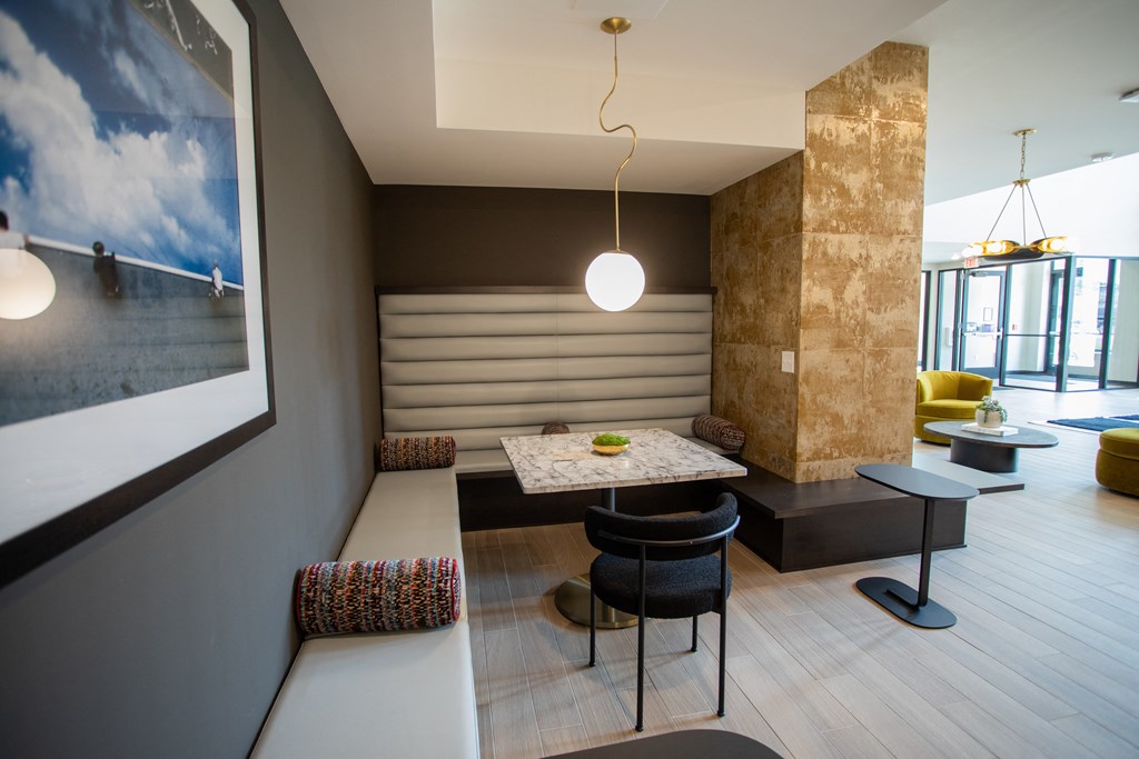 a dining room with a table and chairs and a bench