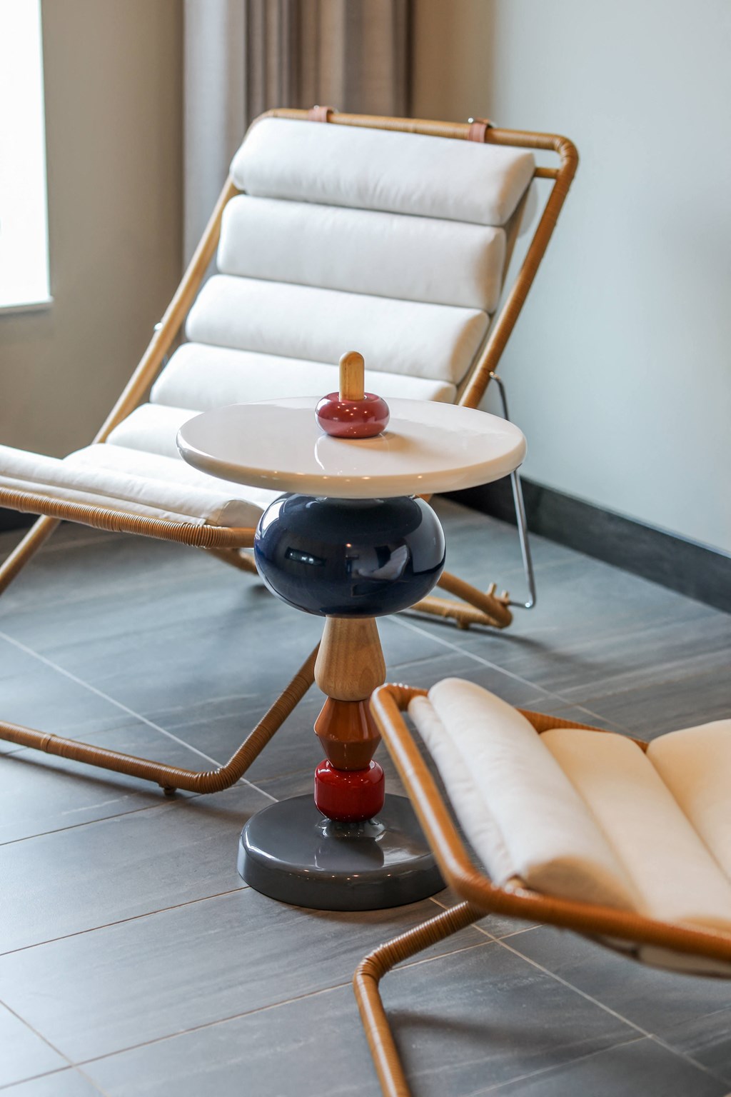 a row of chairs and a table with a rocking chair