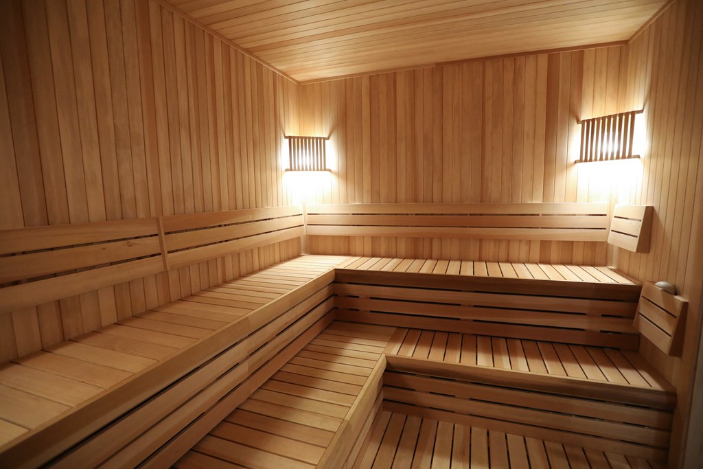 a wooden sauna with two lights in it