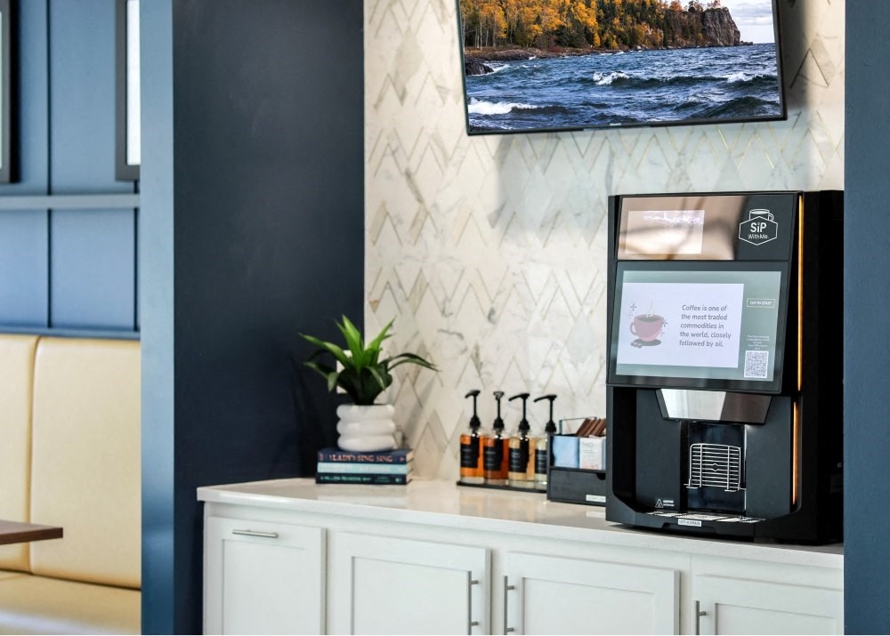a coffee machine sitting on a counter in a hotel room