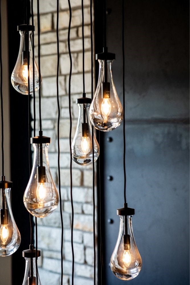 a row of light bulbs hanging from a wall