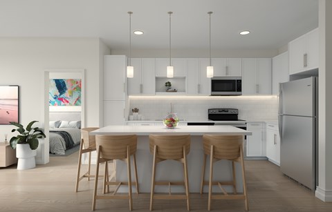 A modern kitchen with a dining table and chairs.