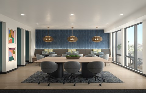 A modern conference room with a long table and chairs.