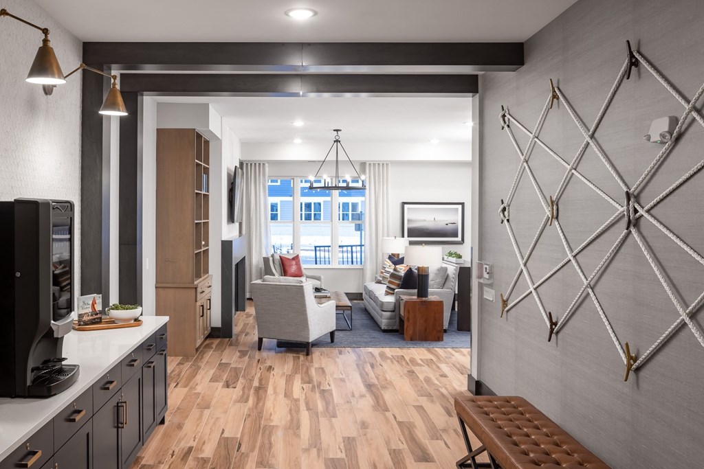 the view of a living room from the kitchen of a model home