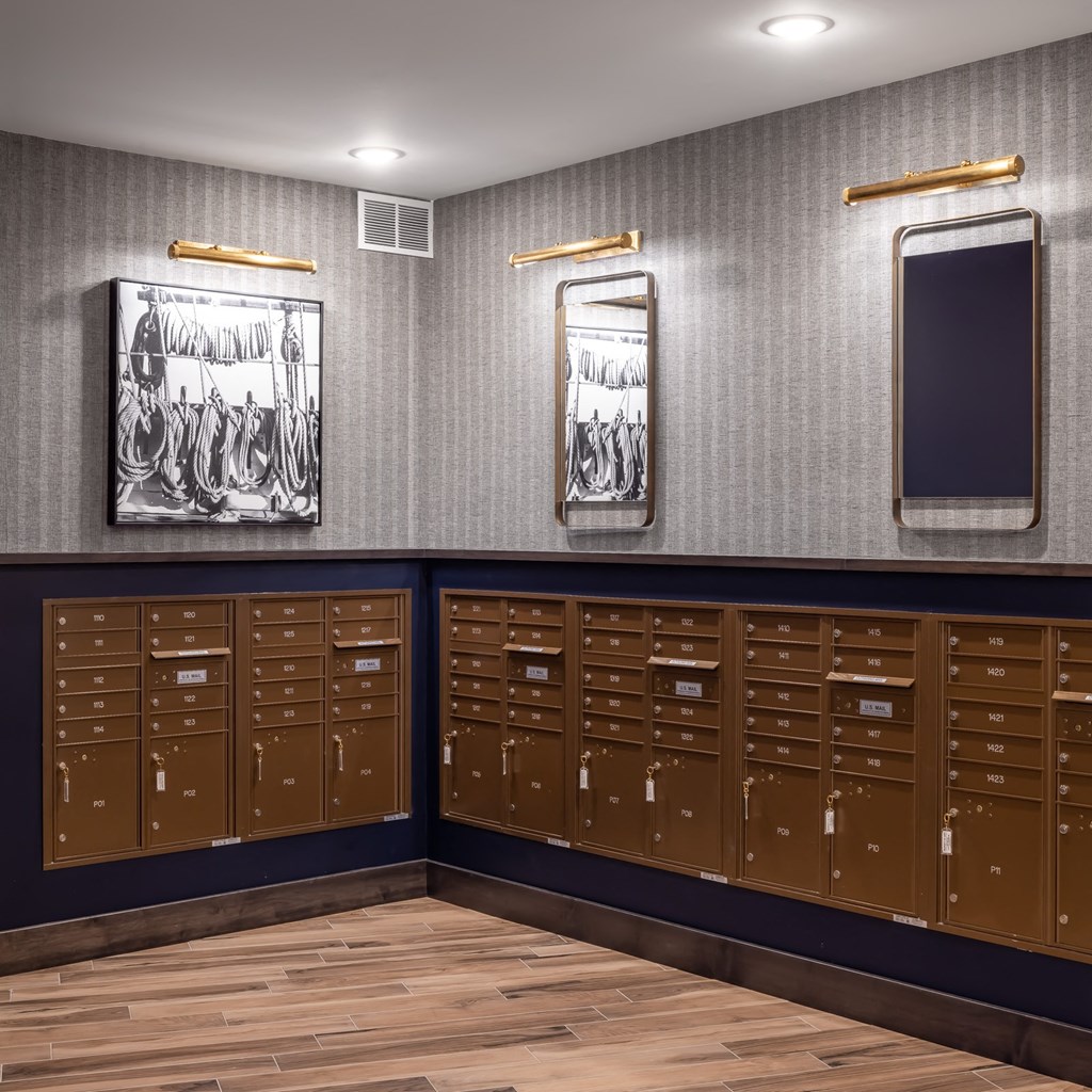 a large locker room with wood floors and brown lockers