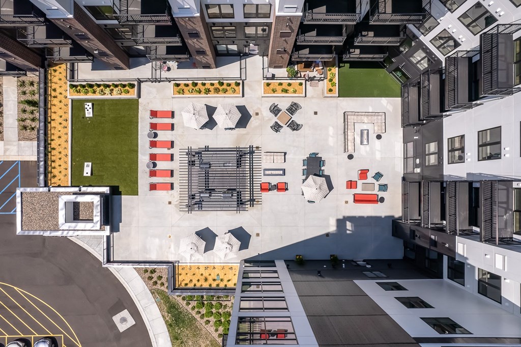 an aerial view of an office building with a courtyard and a basketball court