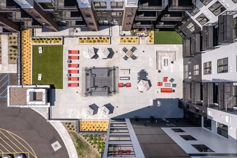 an aerial view of an office building with a courtyard and a basketball court
