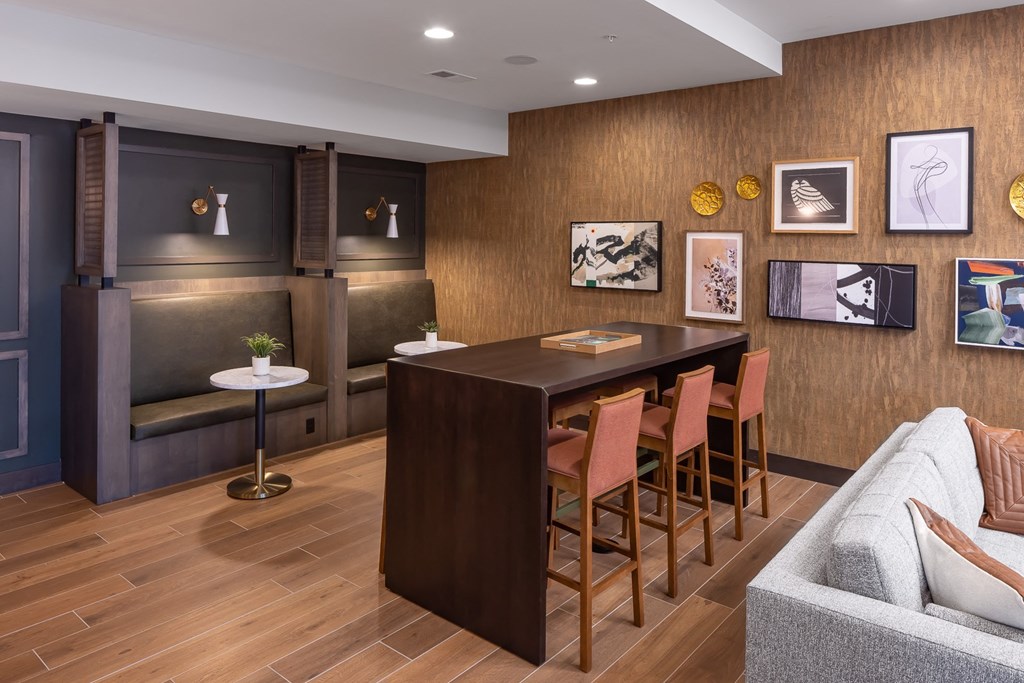 a dining room with a table and chairs and a couch