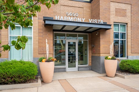 the front of the harrison visit building with a glass door