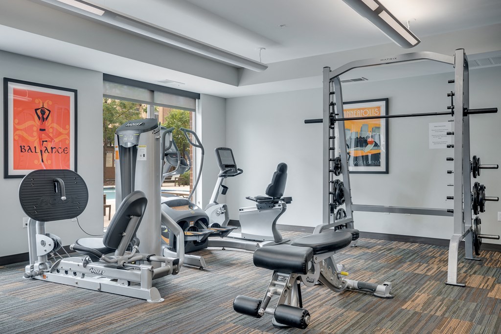 a gym with treadmills and other exercise equipment in a building