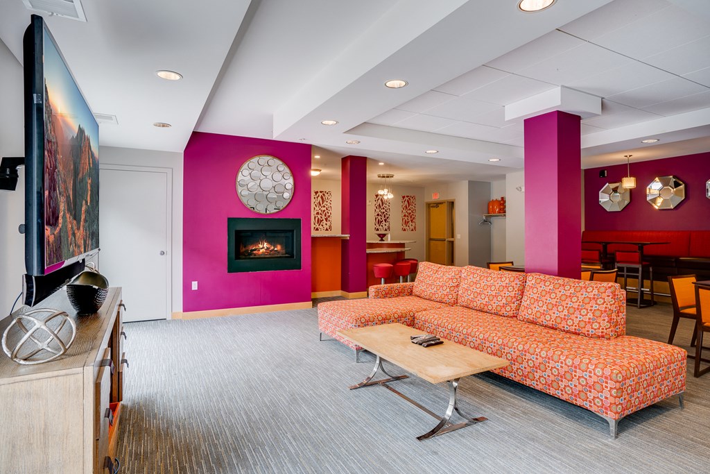a living room with a couch and a fireplace