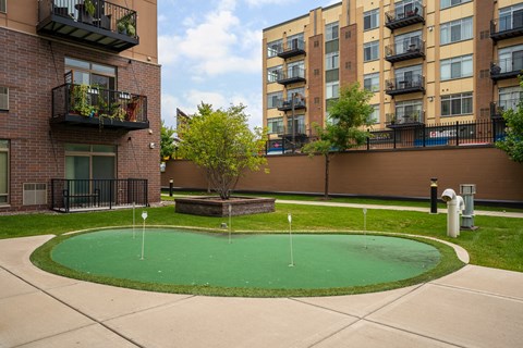 an image of an apartment building with a mini golf course