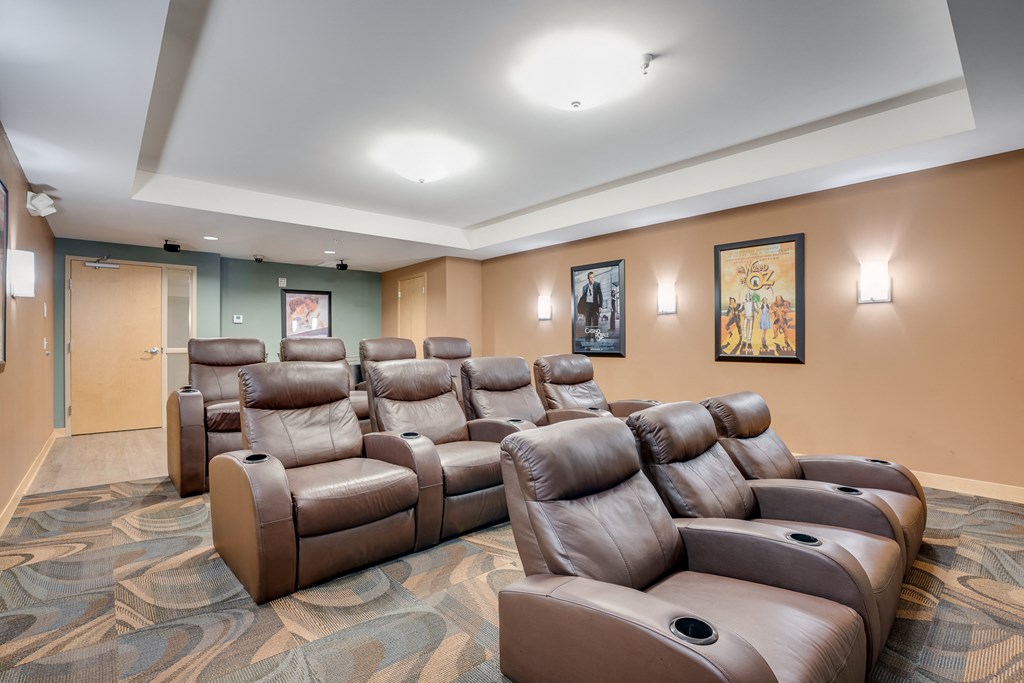 the?? seating area of the cinema room in the lobby of a building