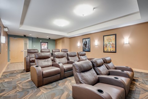 the?? seating area of the cinema room in the lobby of a building