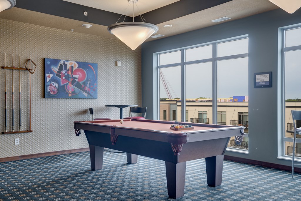 a games room with a pool table