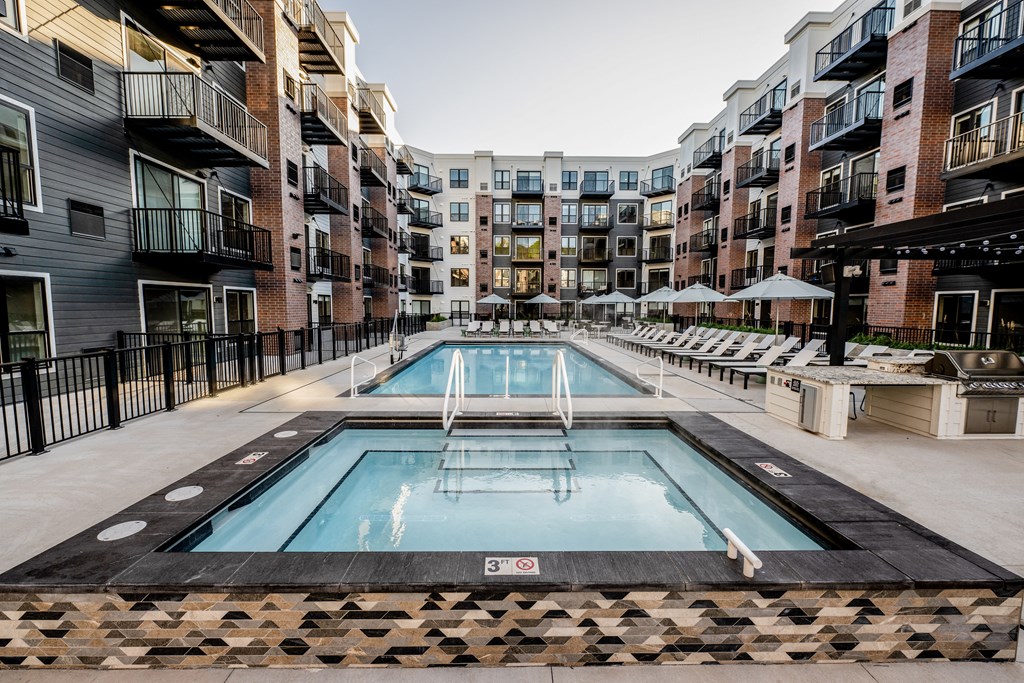 a swimming pool in the middle of an apartment building