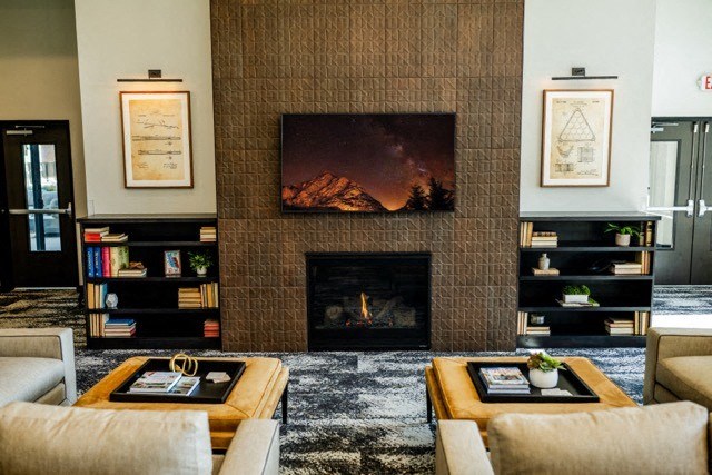 a living room with couches and a fireplace