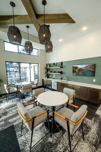 a dining room with a table and chairs