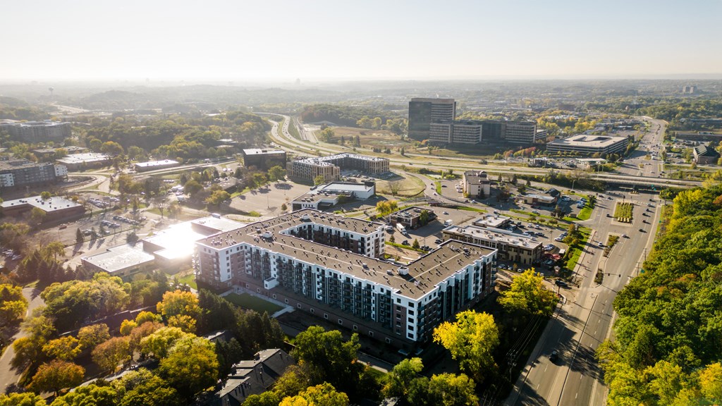 an aerial view of a city with buildings and trees
