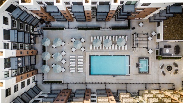 a view of the pool from the roof of a hotel