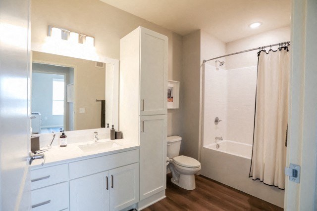 a bathroom with a toilet sink and bathtub