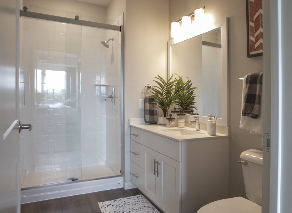 Large bathroom with white vanity