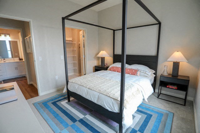 a bedroom with a bed and two nightstands